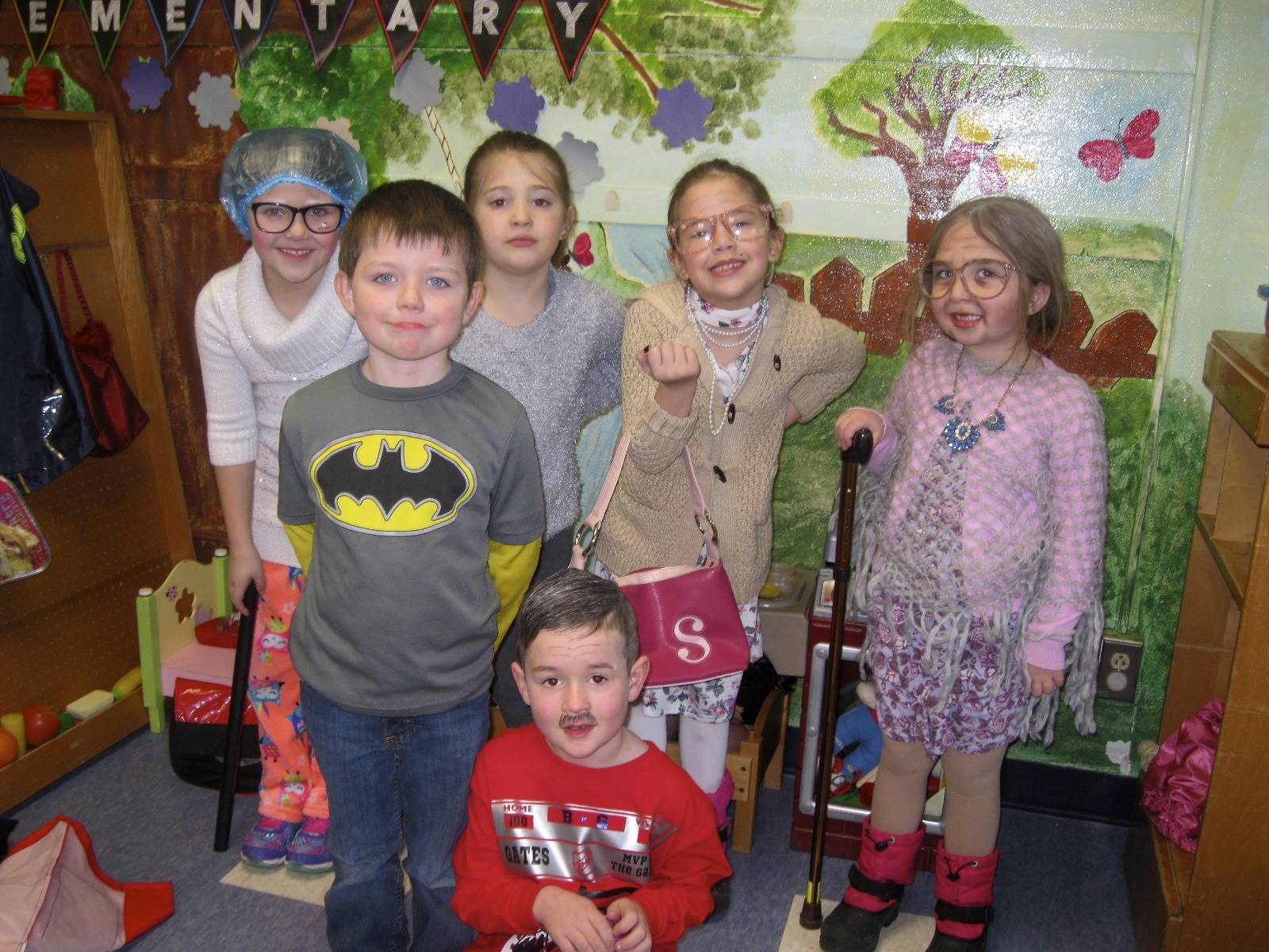 6 students dressed up for 100th day of school.