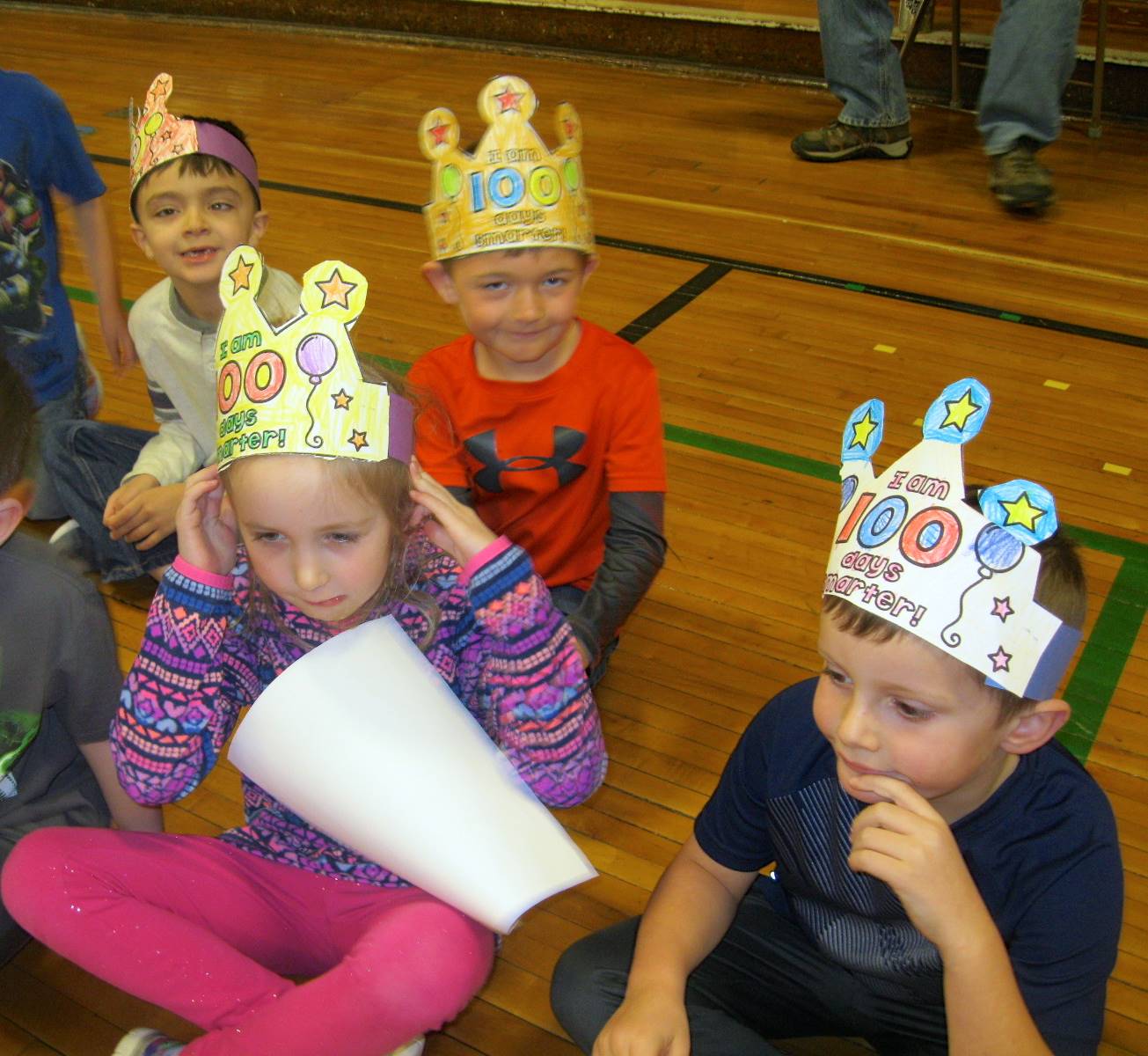 Students wearing, "100 days of being smarter" hats.