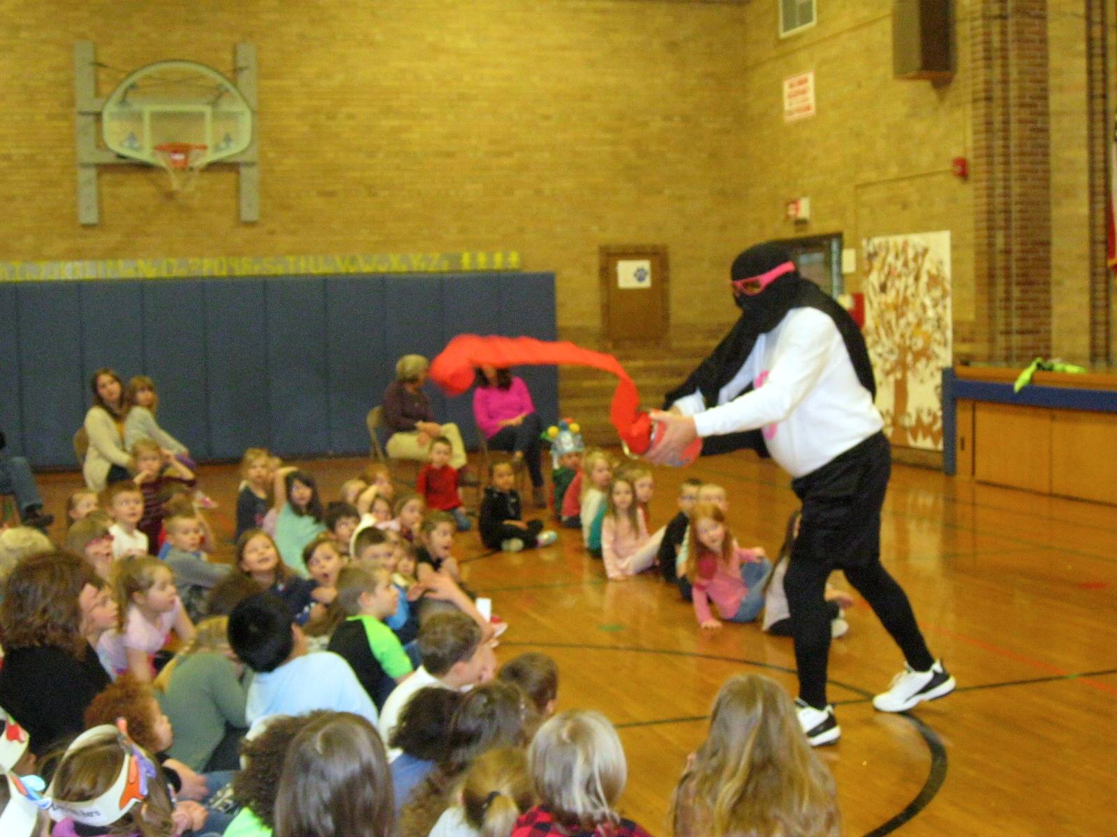 Zero throws some red "paint" on students. 