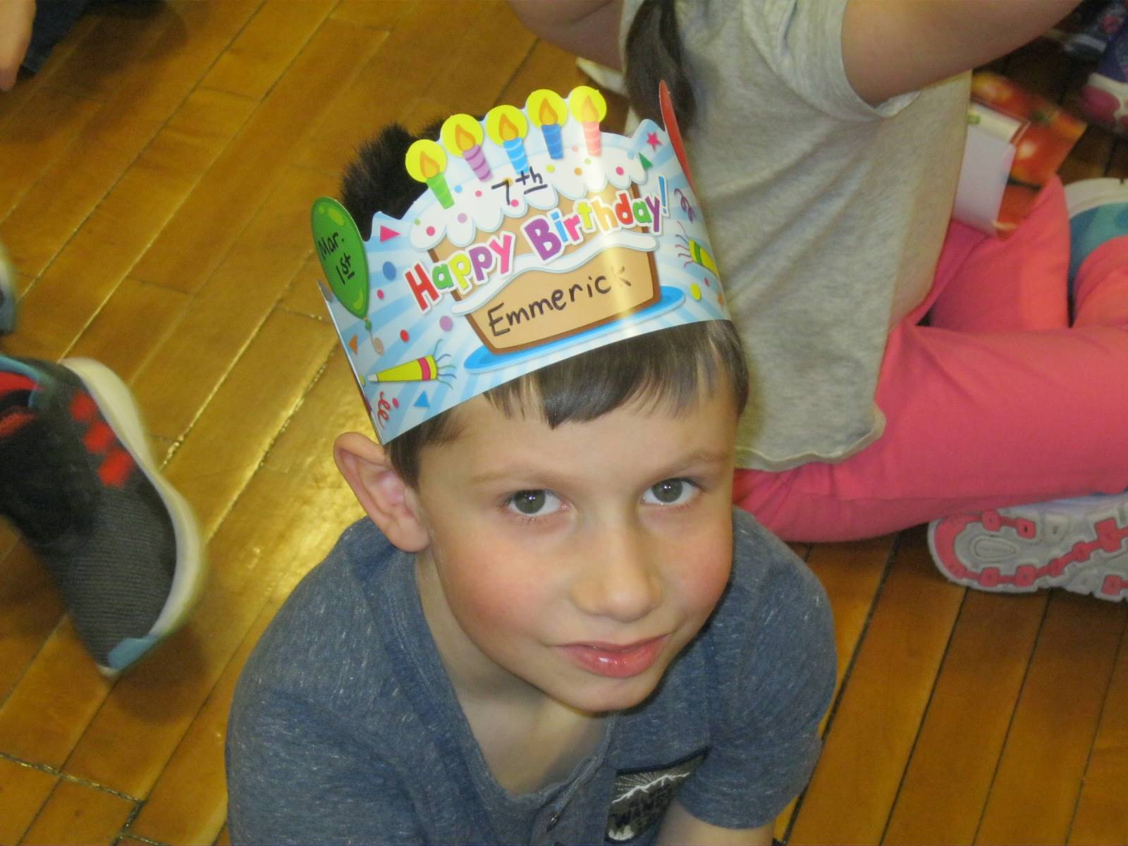 A student with a birthday hat on has the same birthday as Zero the Hero!