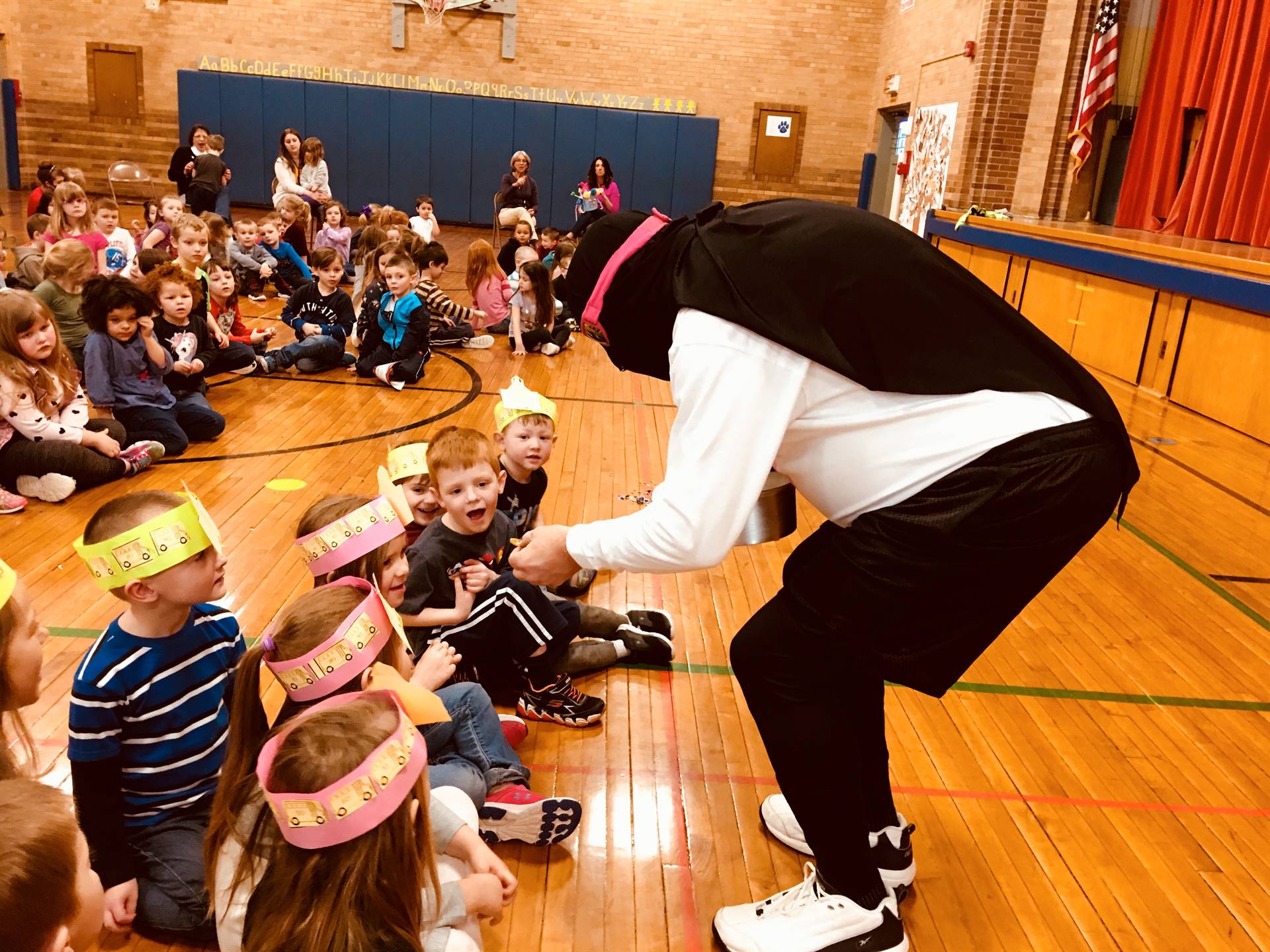 Zero the Hero wows students with his magic.