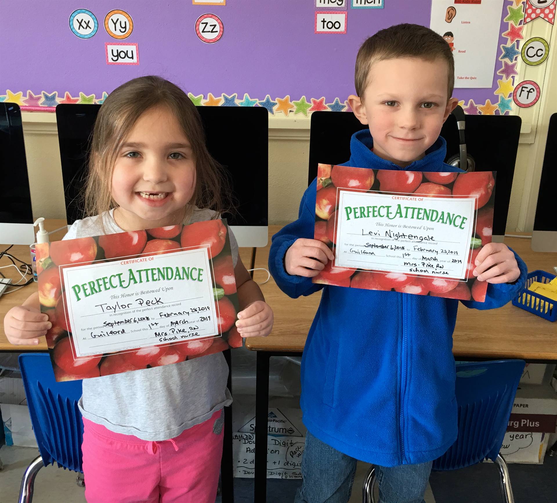 2 students with perfect 100 days attendance!
