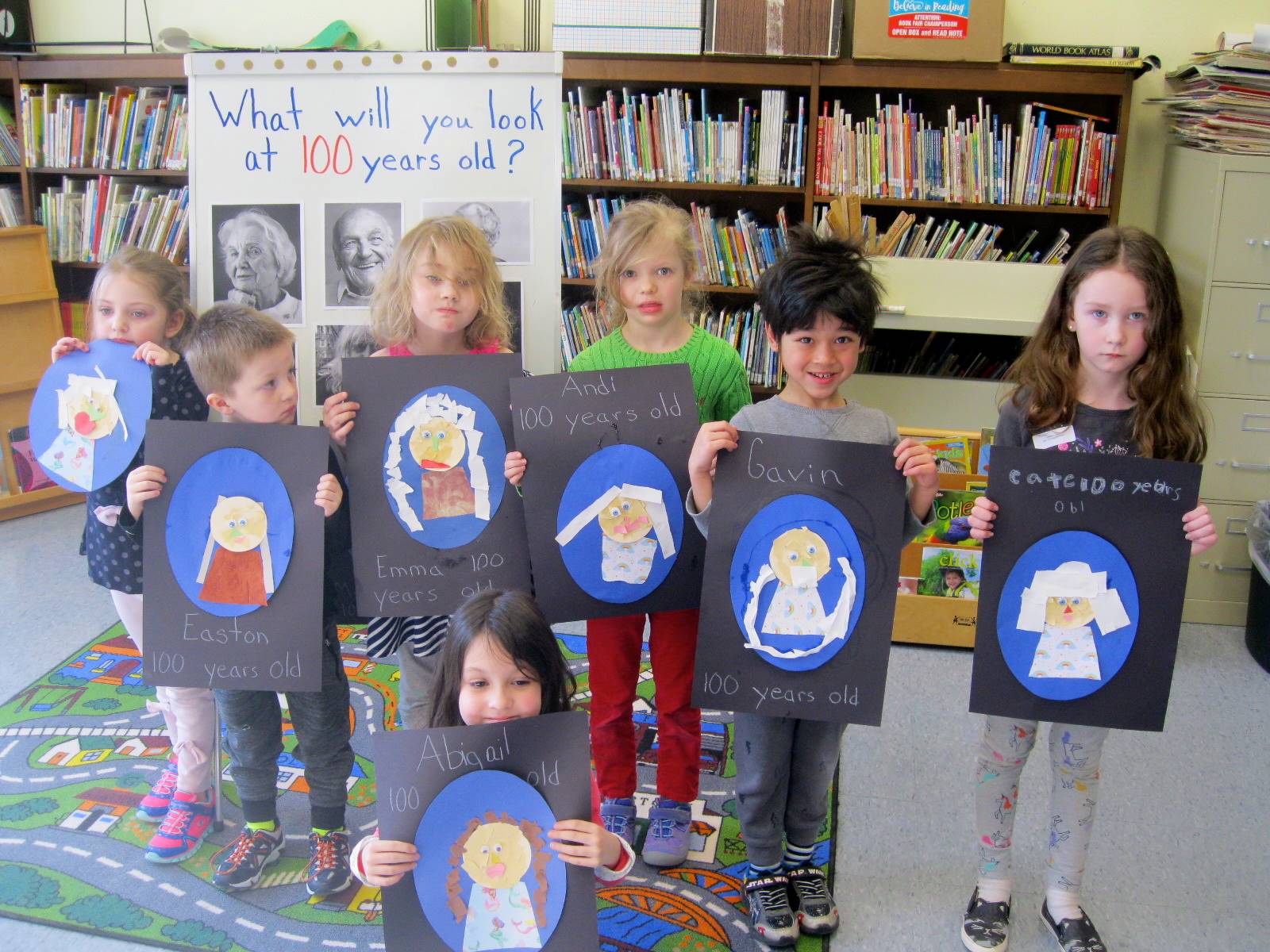 7 students with their 100 year old portraits!