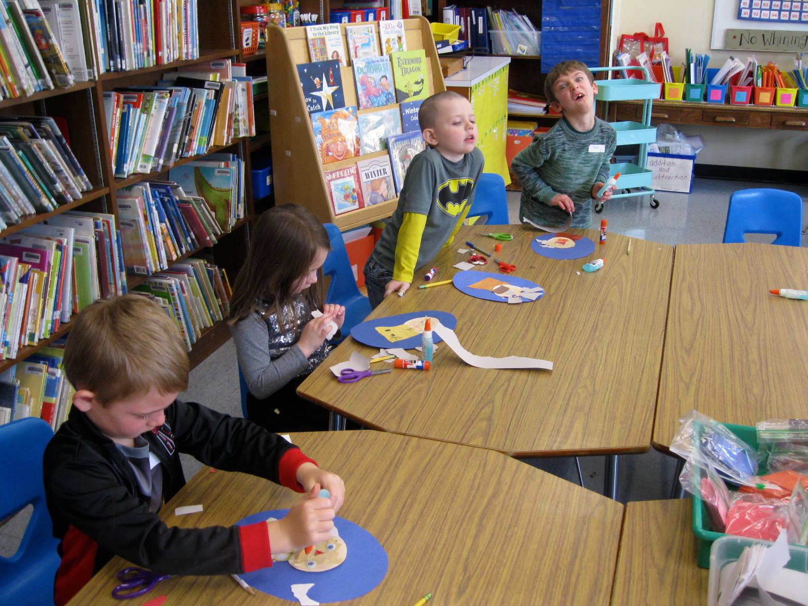 Students create their 100 year old portraits.