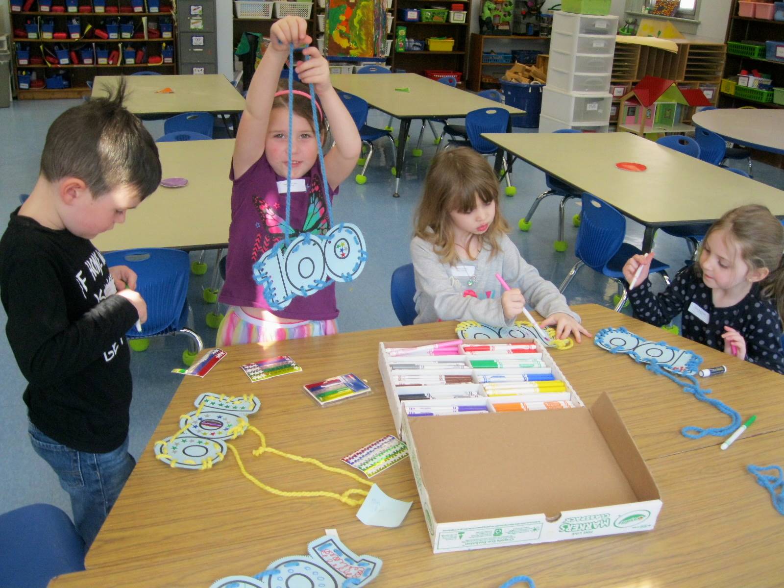 4 students sew 100 necklaces.