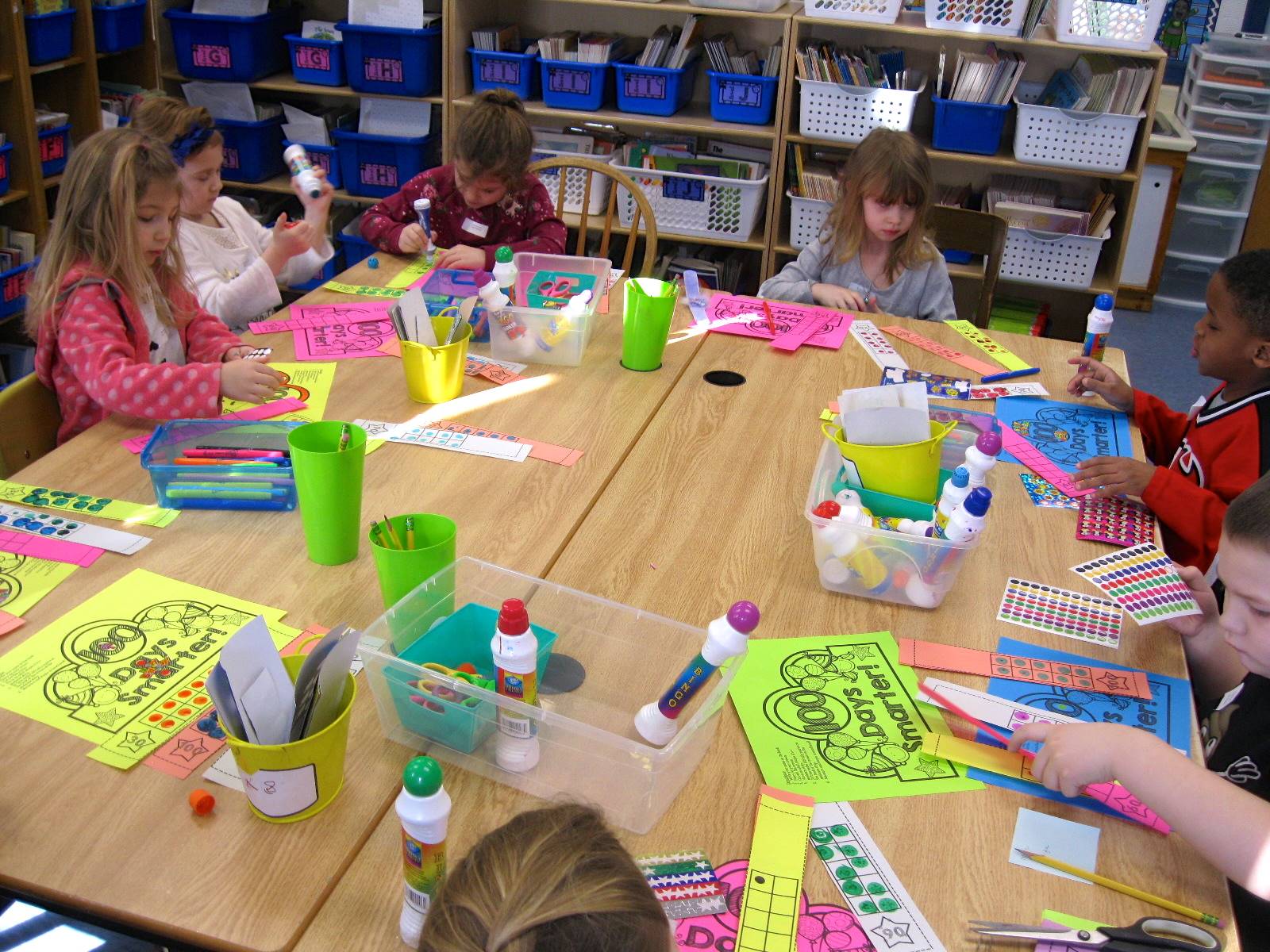 a group of students creating 100 day crown.