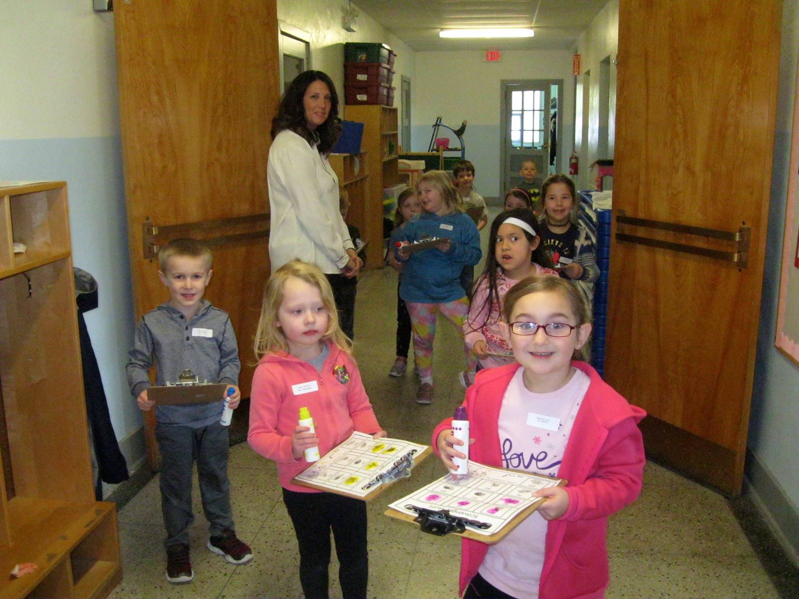 A teacher and a group of students on a scavenger hunt!