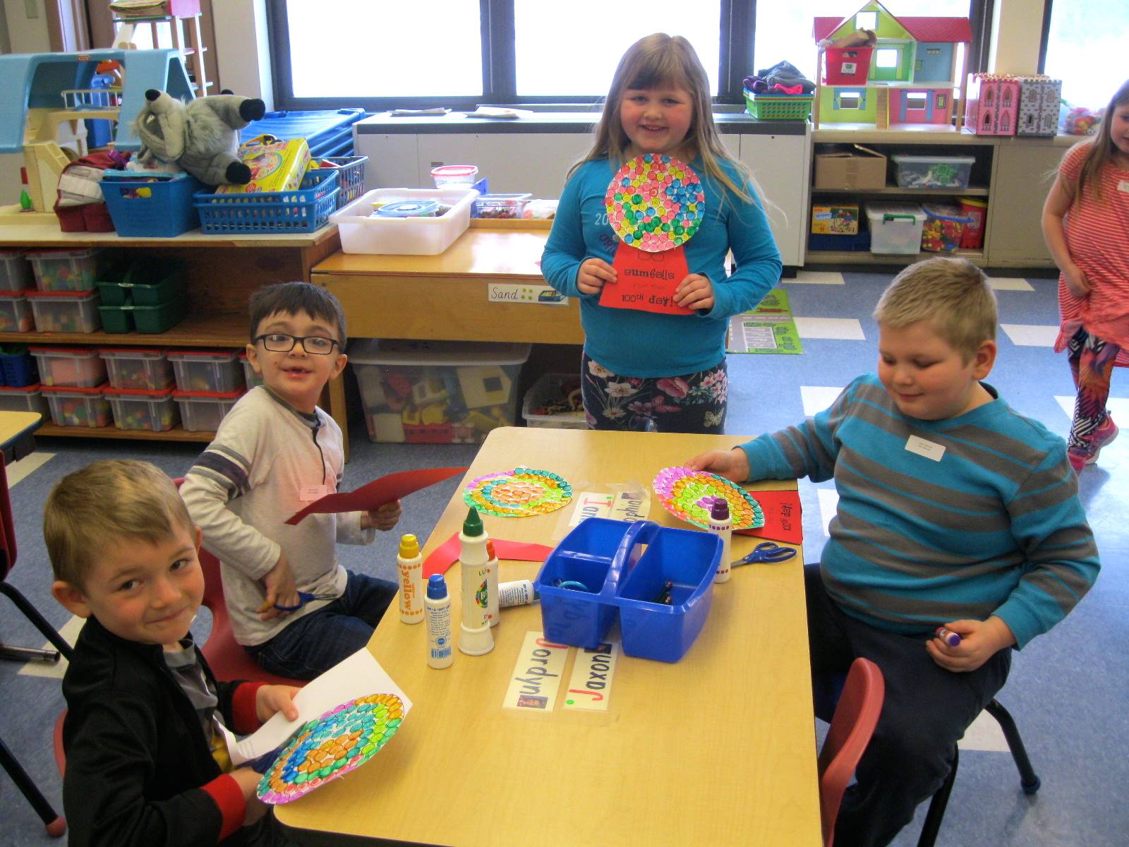 Students paint 100 gum balls on their gum ball machine.