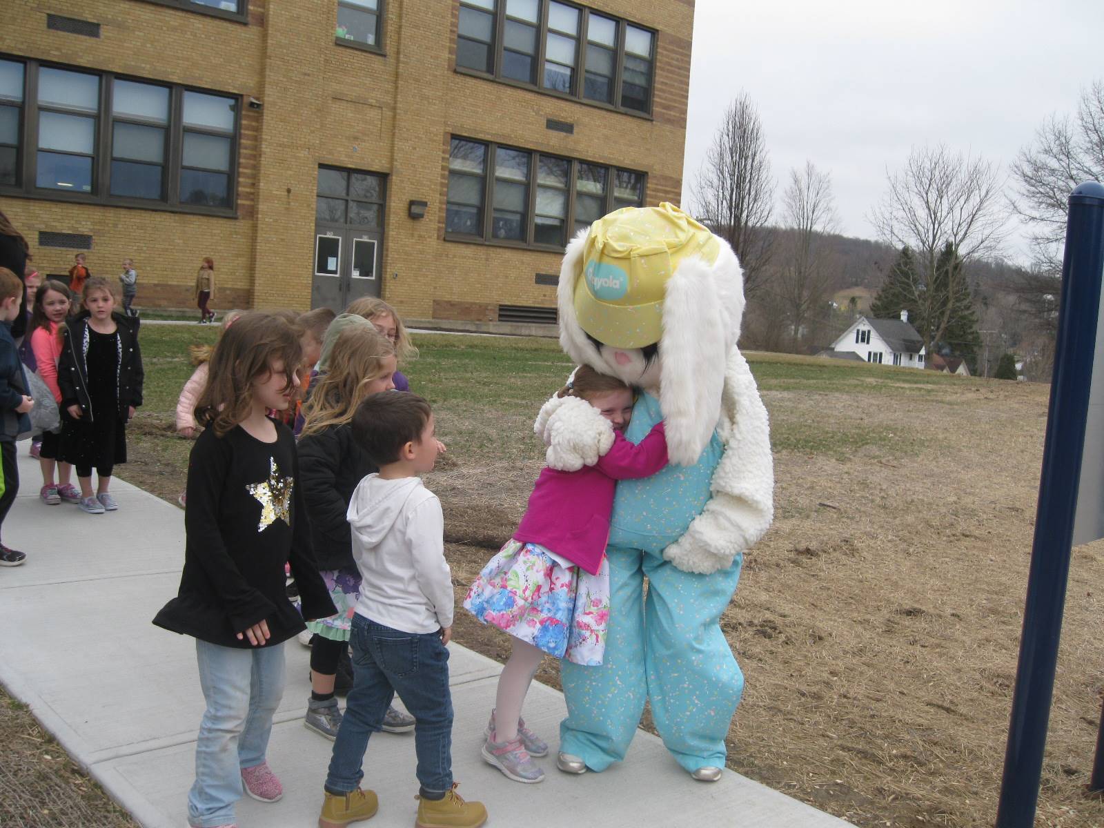 Easter Bunny Greets students coming out to play.