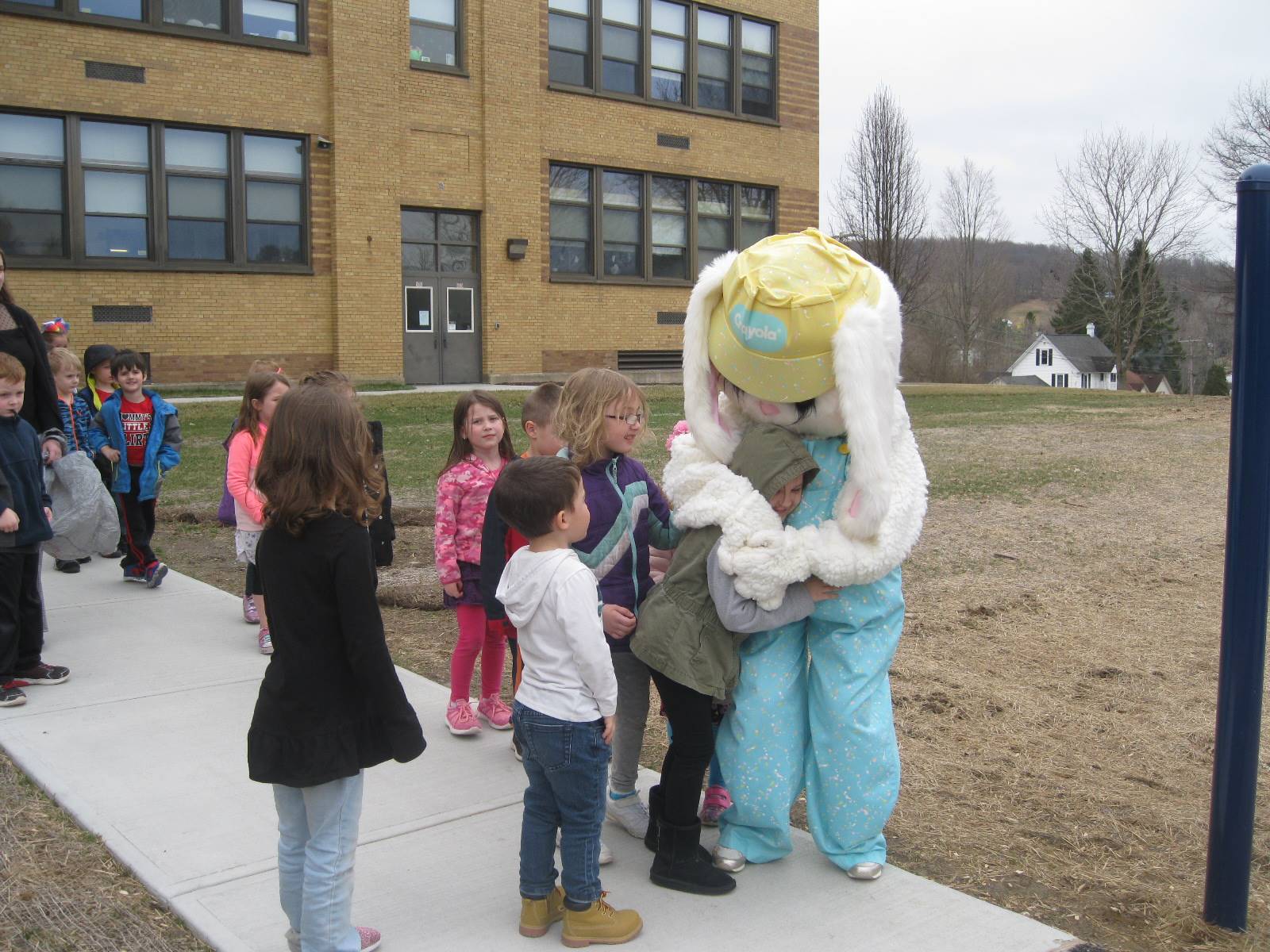 A student gives Easter Bunny a warm "bunny" hug.