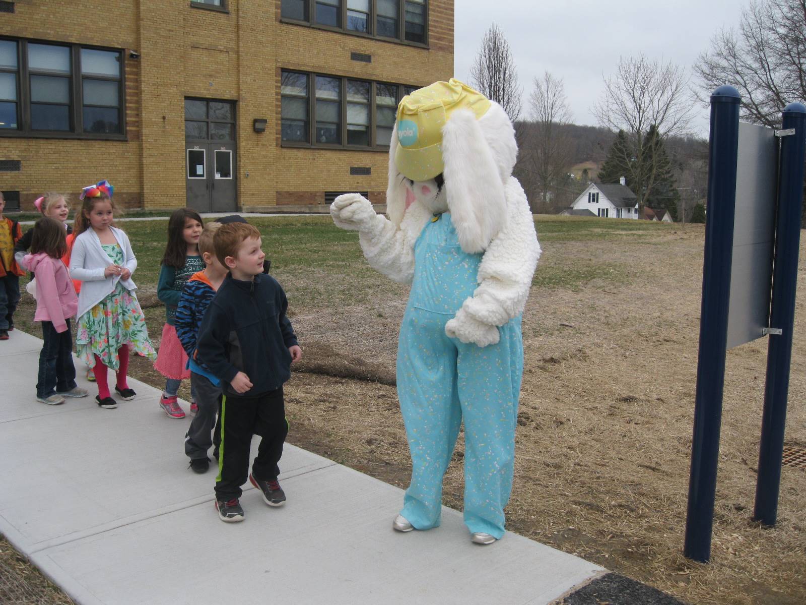 Students get a surprise greeting from Easter Bunny outside.