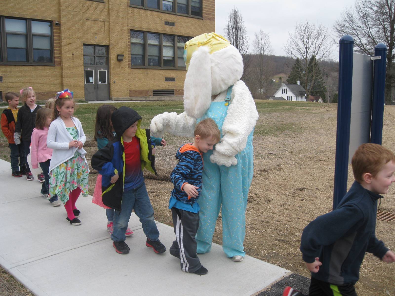 Students get a surprise greeting from Easter Bunny outside.