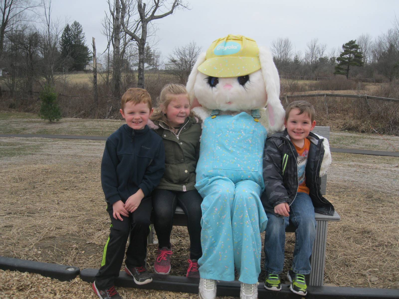 3 students and Easter Bunny.
