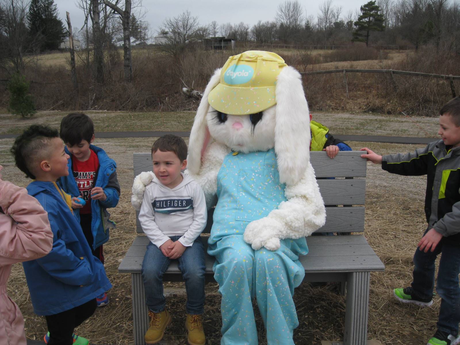Students and Easter Bunny on the playground.
