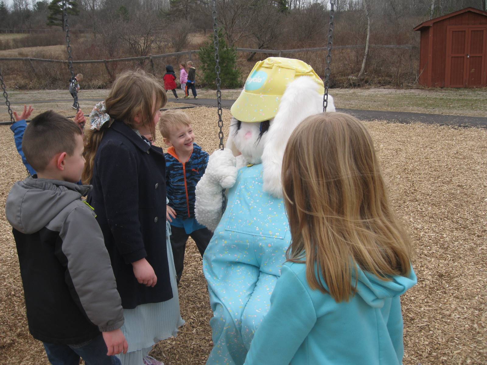 Students teach Easter Bunny how to swing!