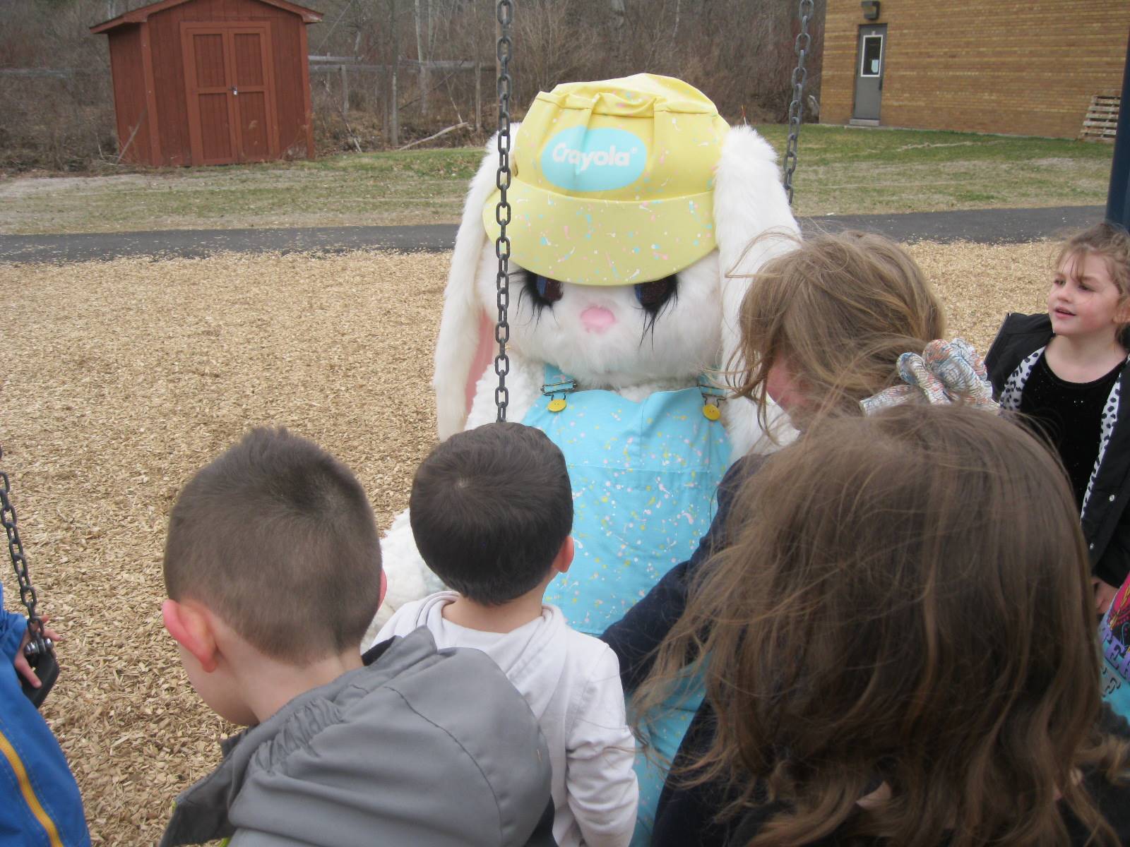 Students teach Easter Bunny how to swing!