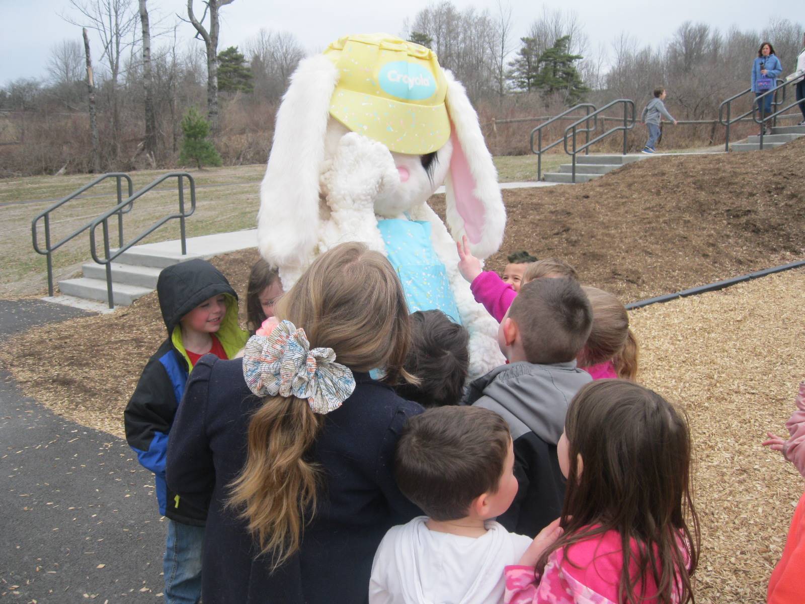 Easter Bunny plays peek a boo with students.