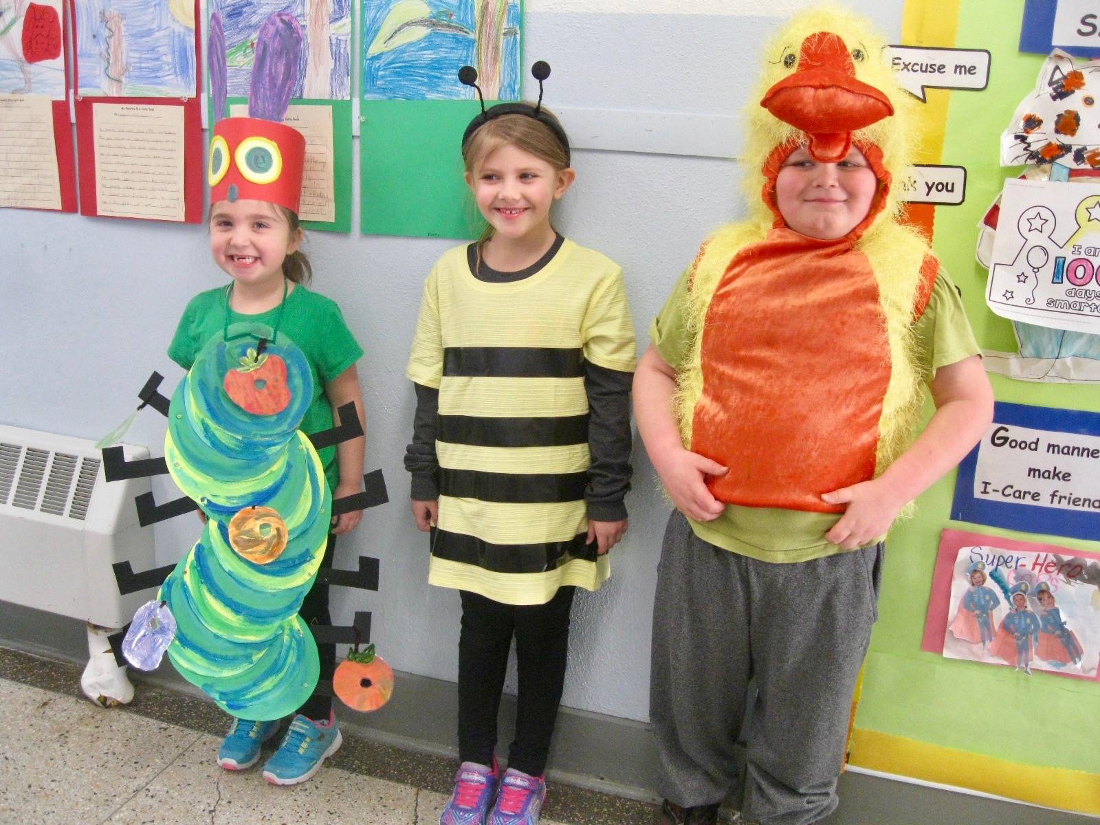 3 students dressed like their favorite animal.