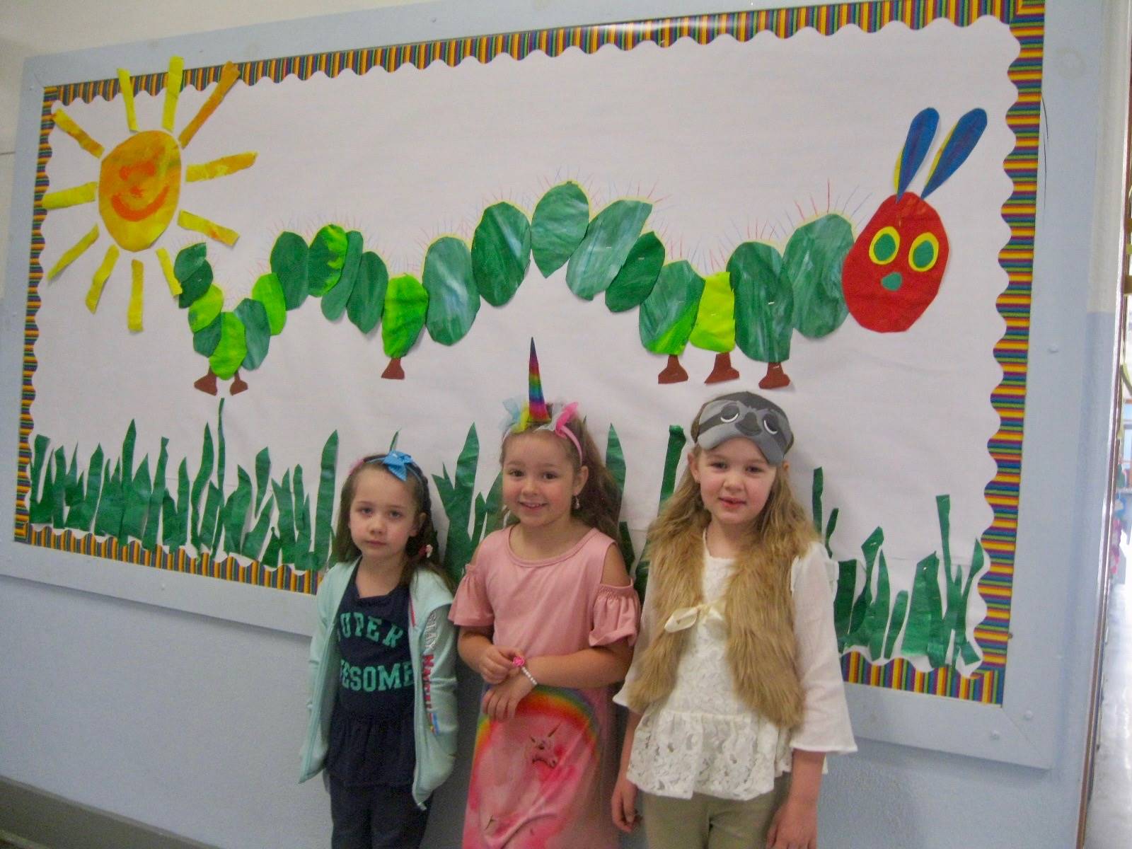 3 students dressed like their favorite animal.