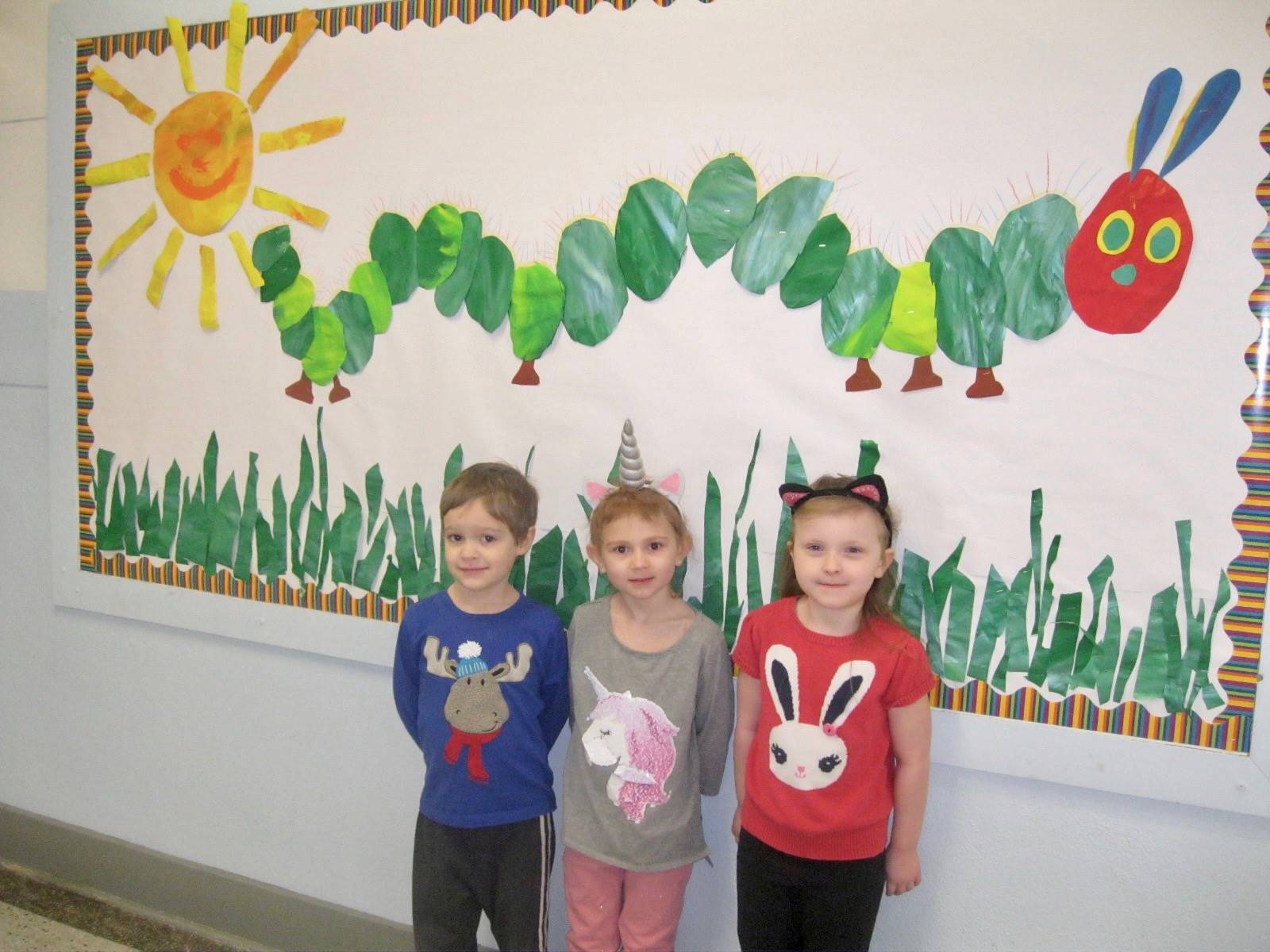 3 students dressed like their favorite animal.