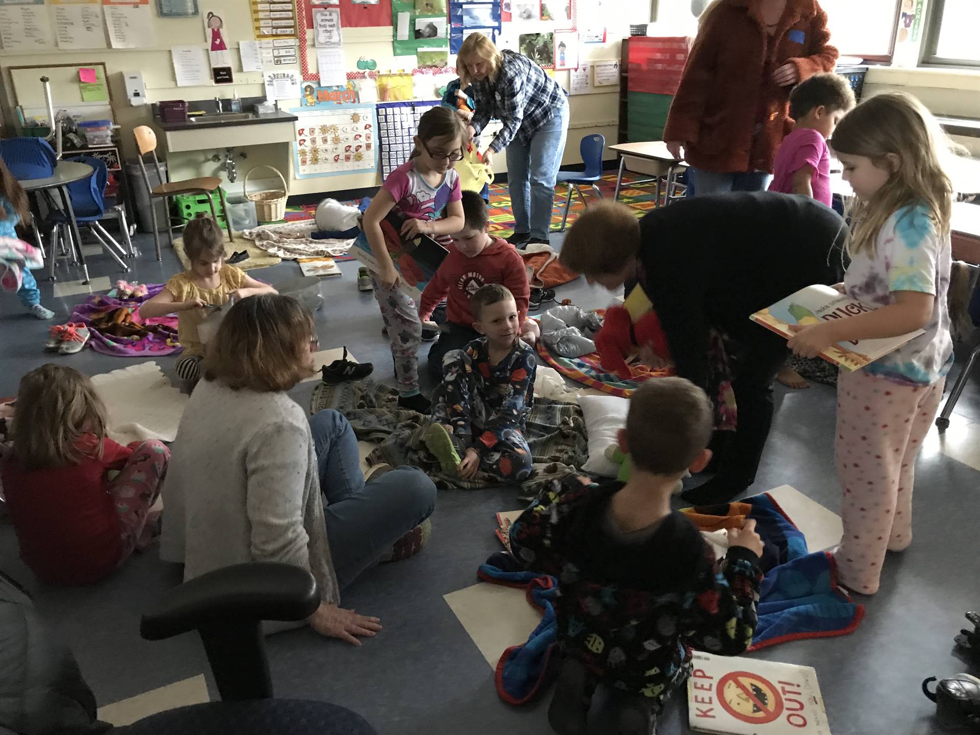 Students in Pajamas read together.