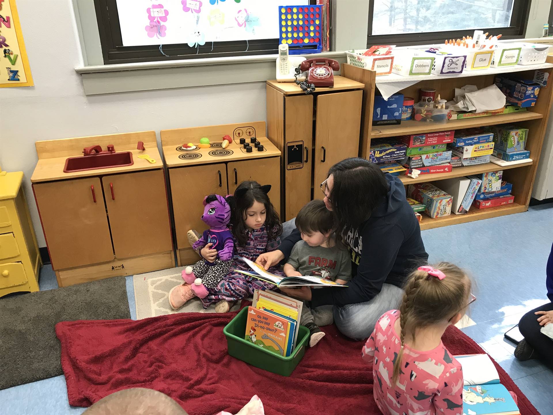 A parent reads with 2 students.