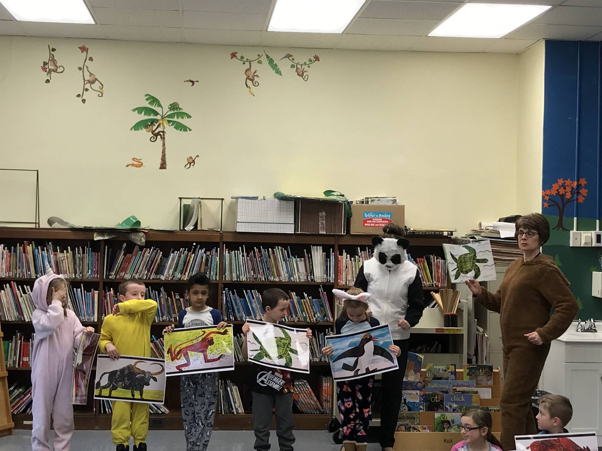 First grade students with Brown Bear and a teacher.