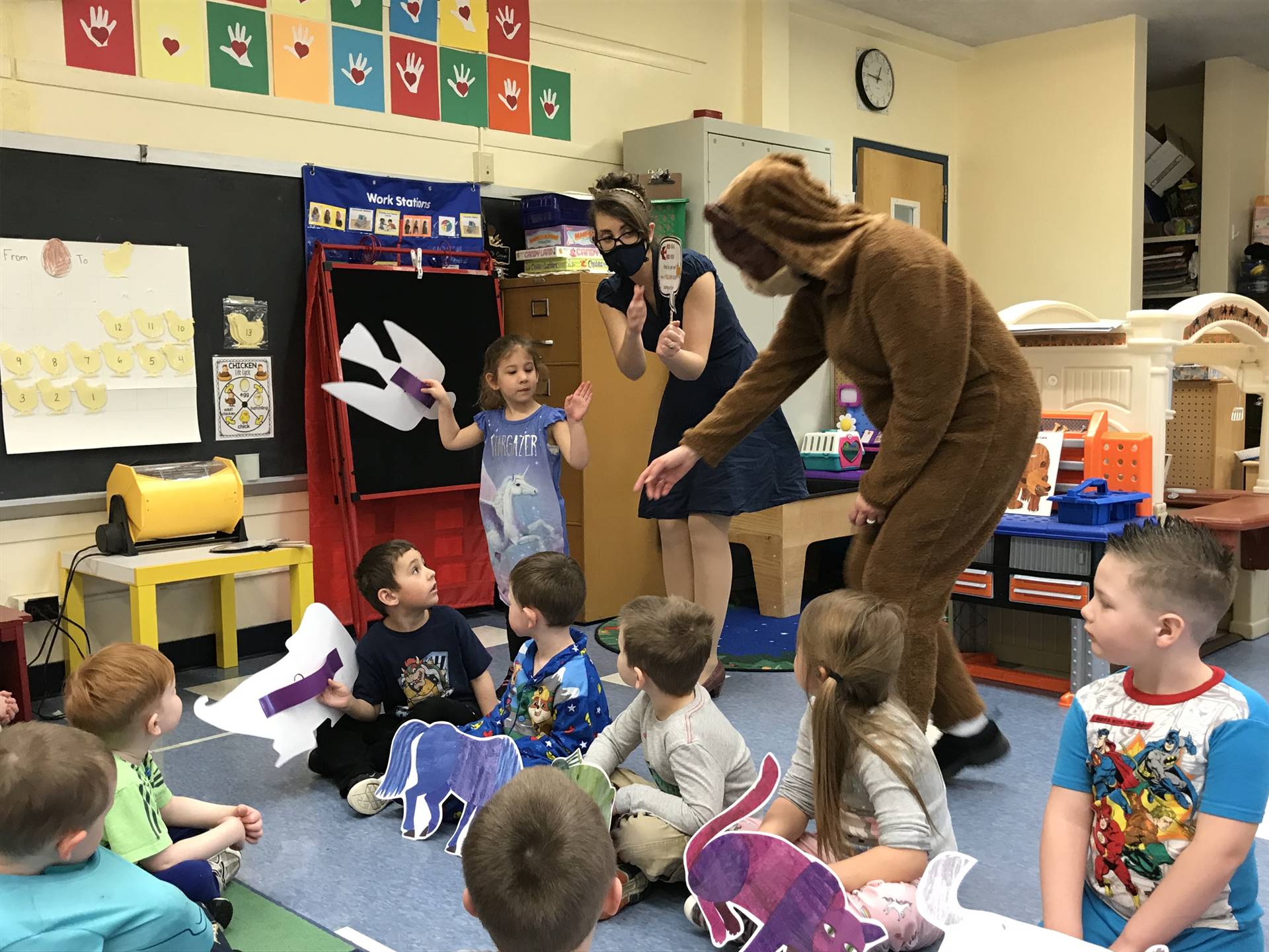 Pre-K students with Brown Bear and a teacher.