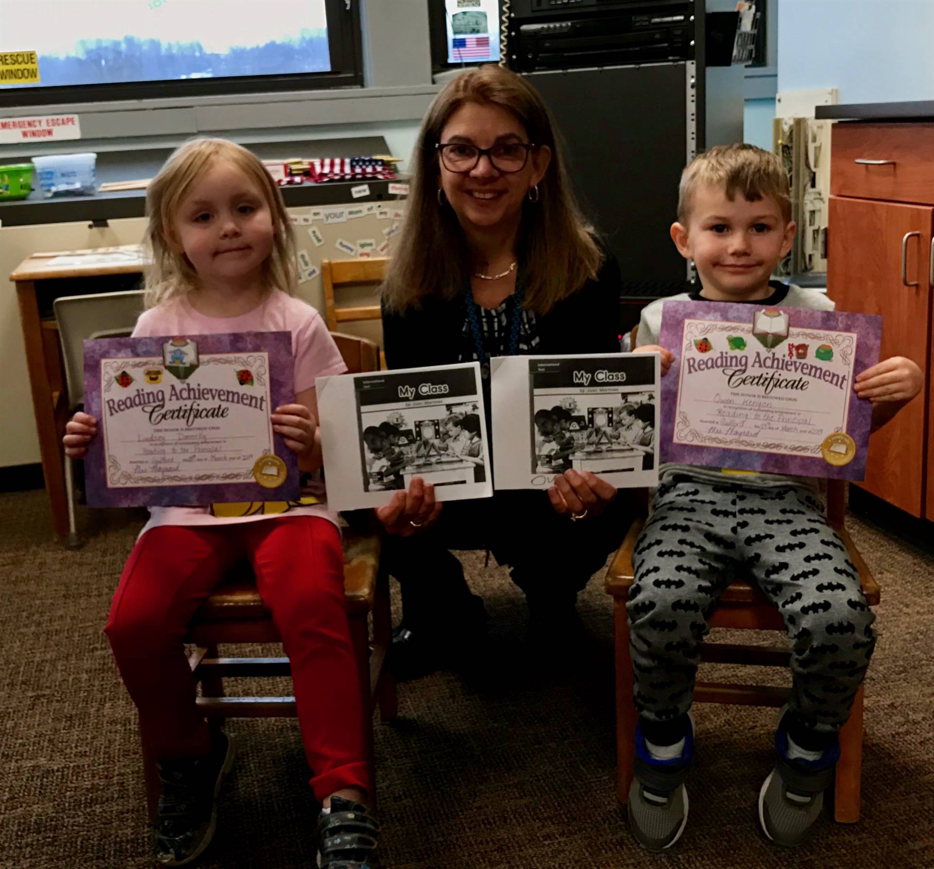 Principal with 2 kindergarten students.