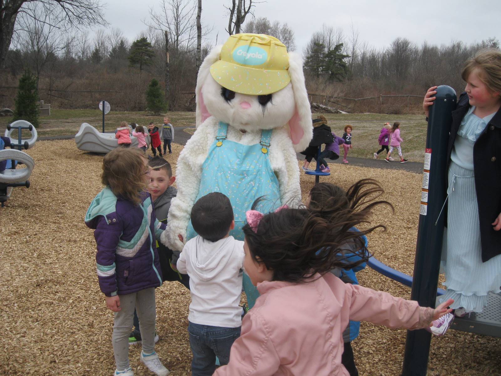 The Easter Bunny with a group of students.