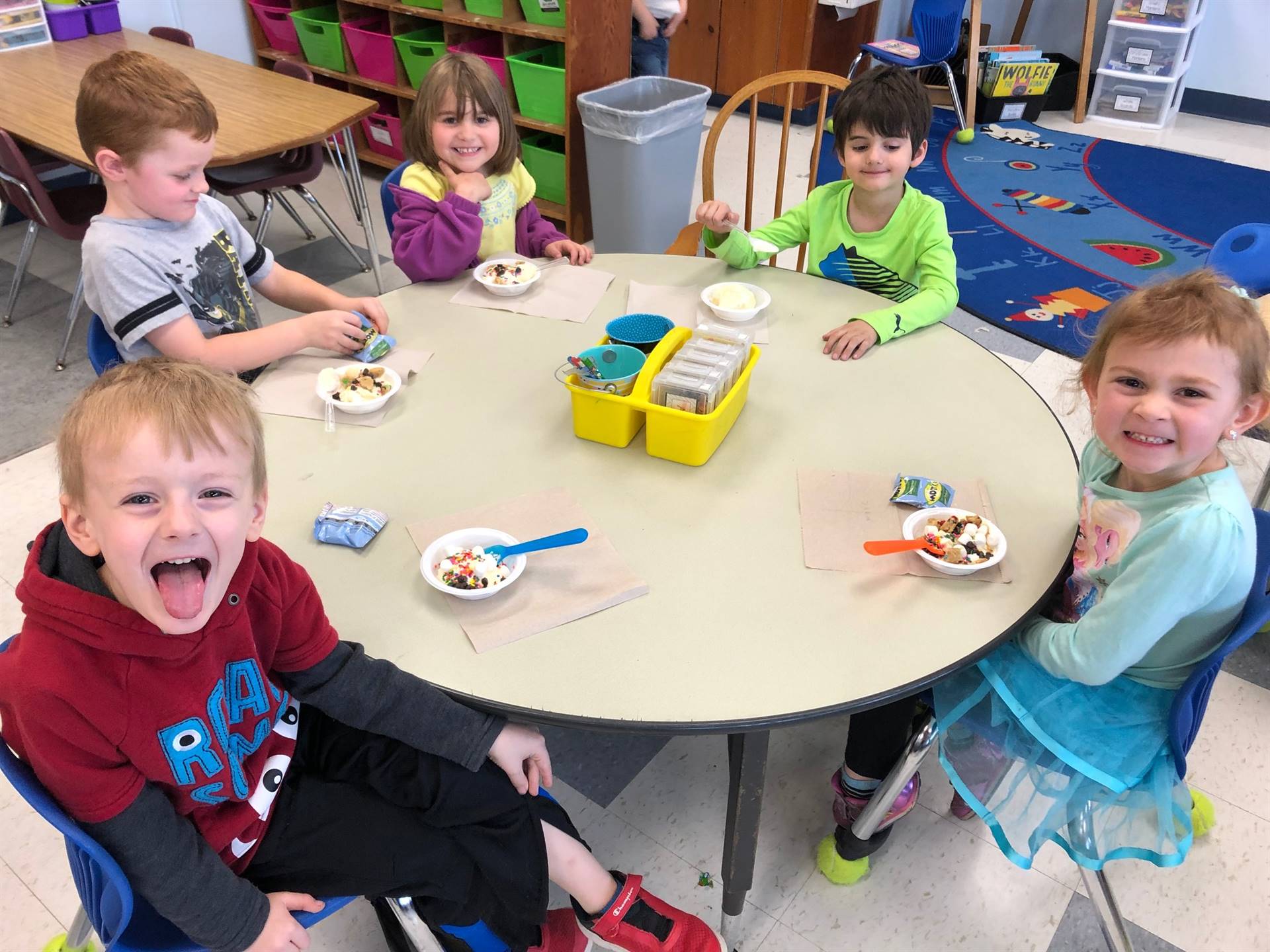 5 students enjoy a hard earned ice cream party