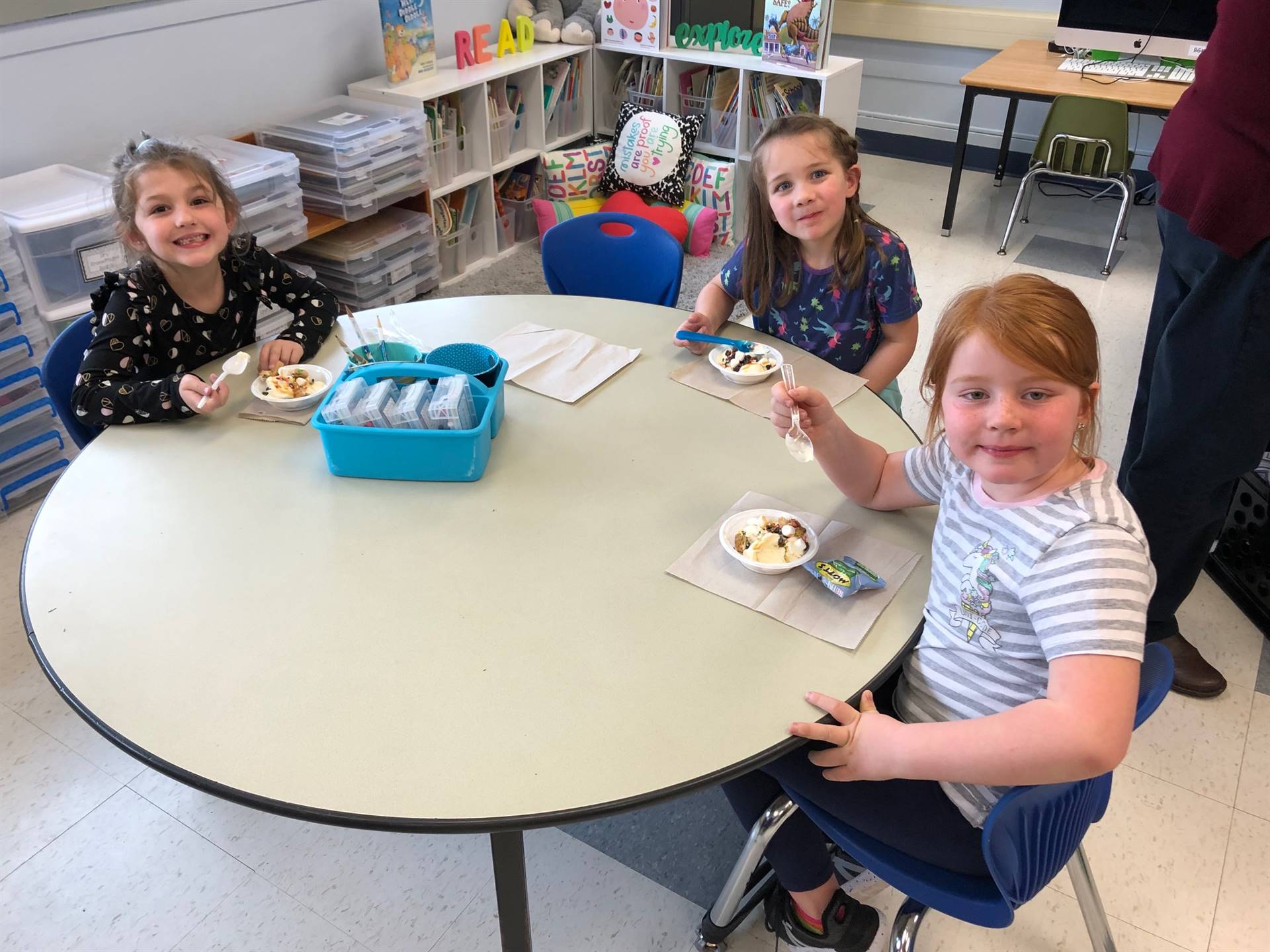 3 students enjoy a hard earned ice cream party