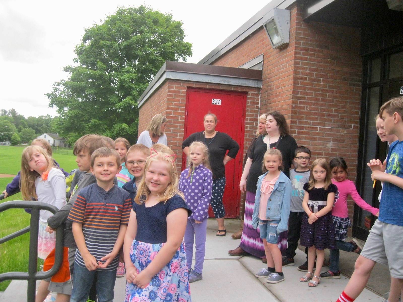 Class of students view playground.