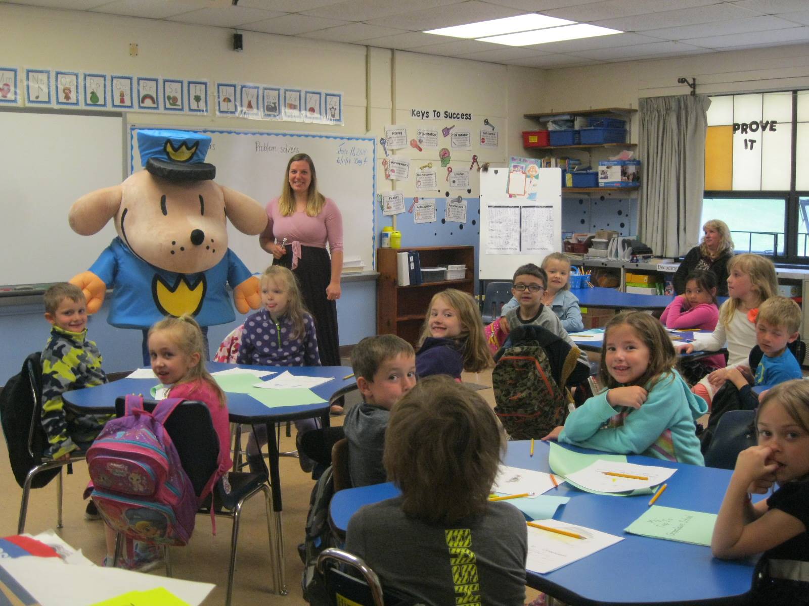 Dogman and 1st grade students.