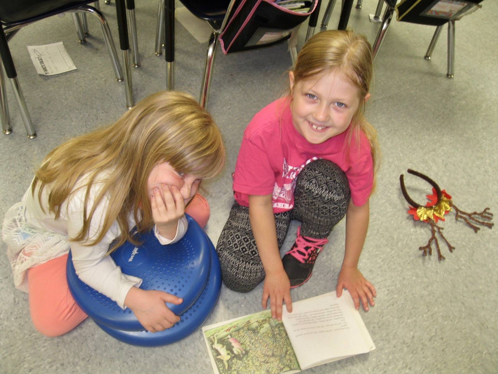 2nd grader reading to 1st grader