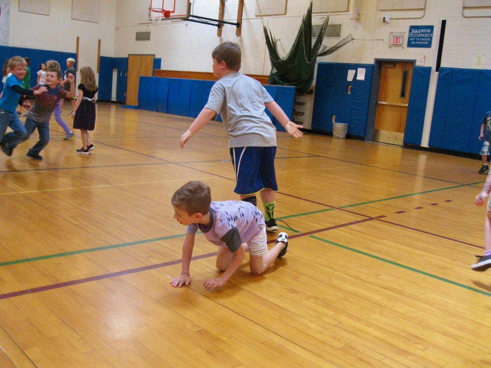 2 students playing mud tag.