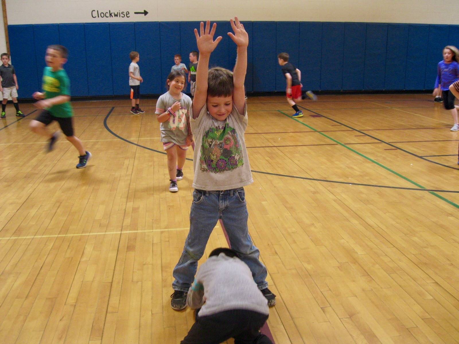 2 students playing mud tag.