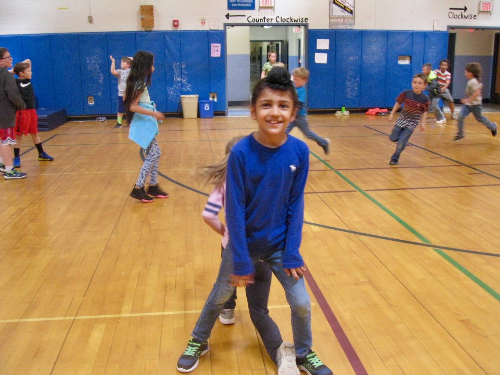 Students playing mud tag.