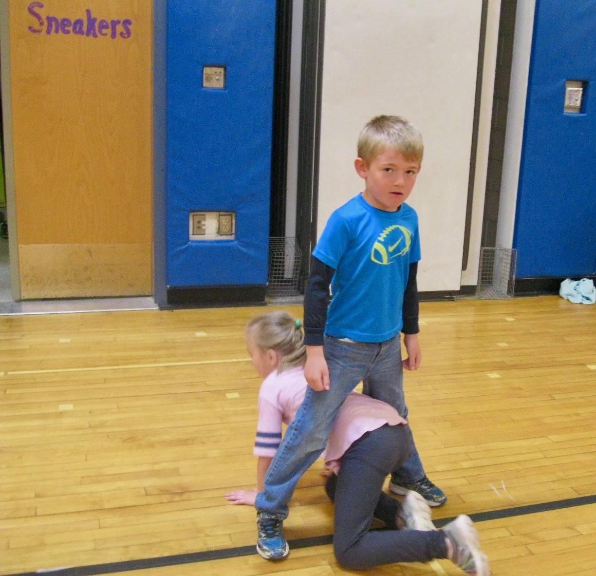 2 students playing mud tag.