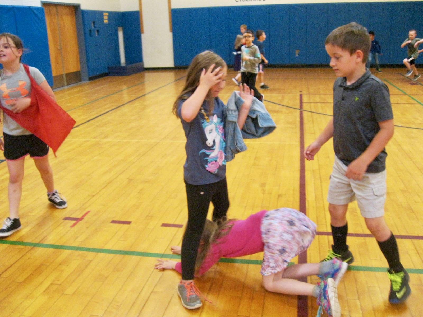 Students playing mud tag.