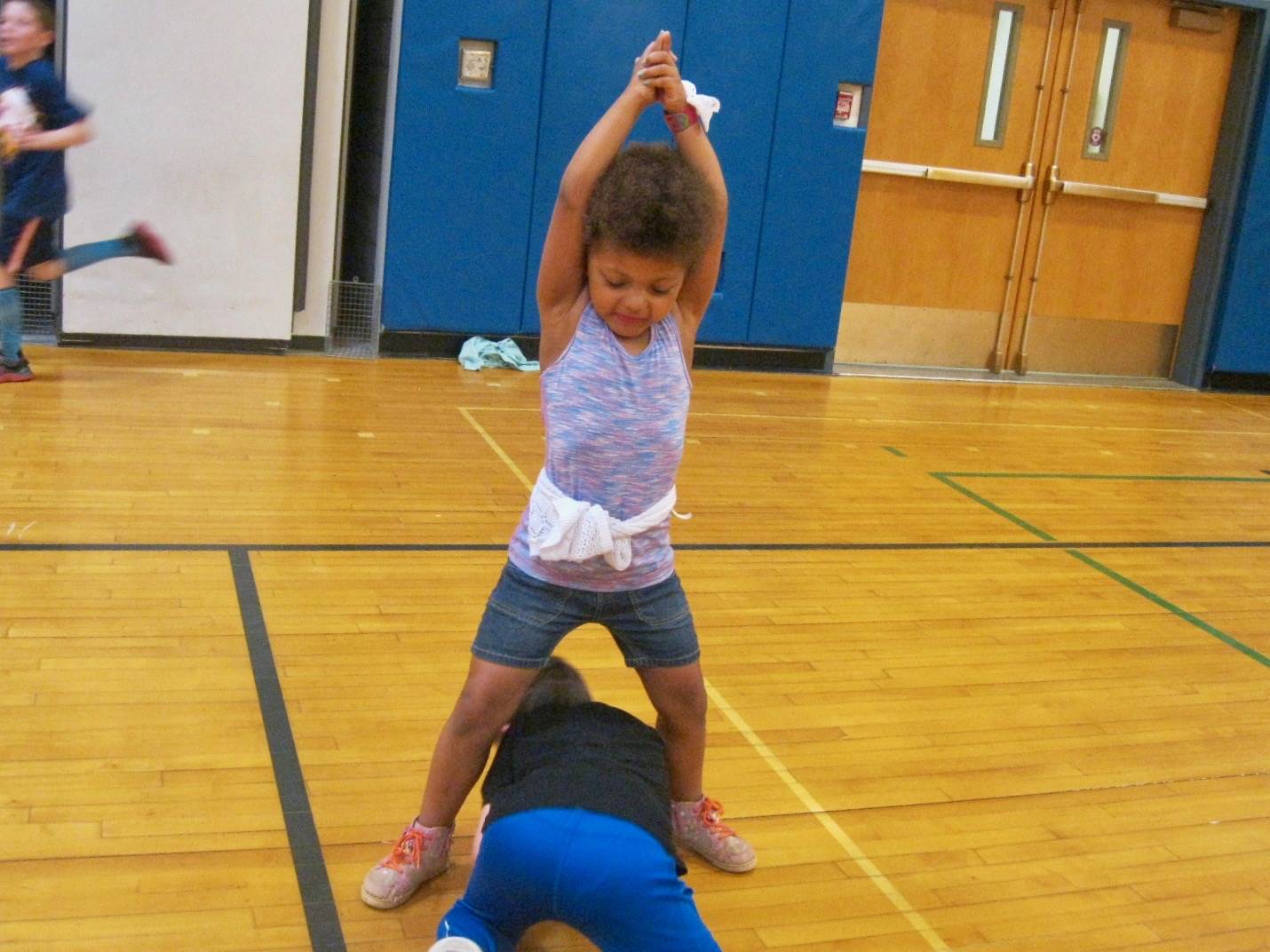 1 student frees another student playing mud tag.