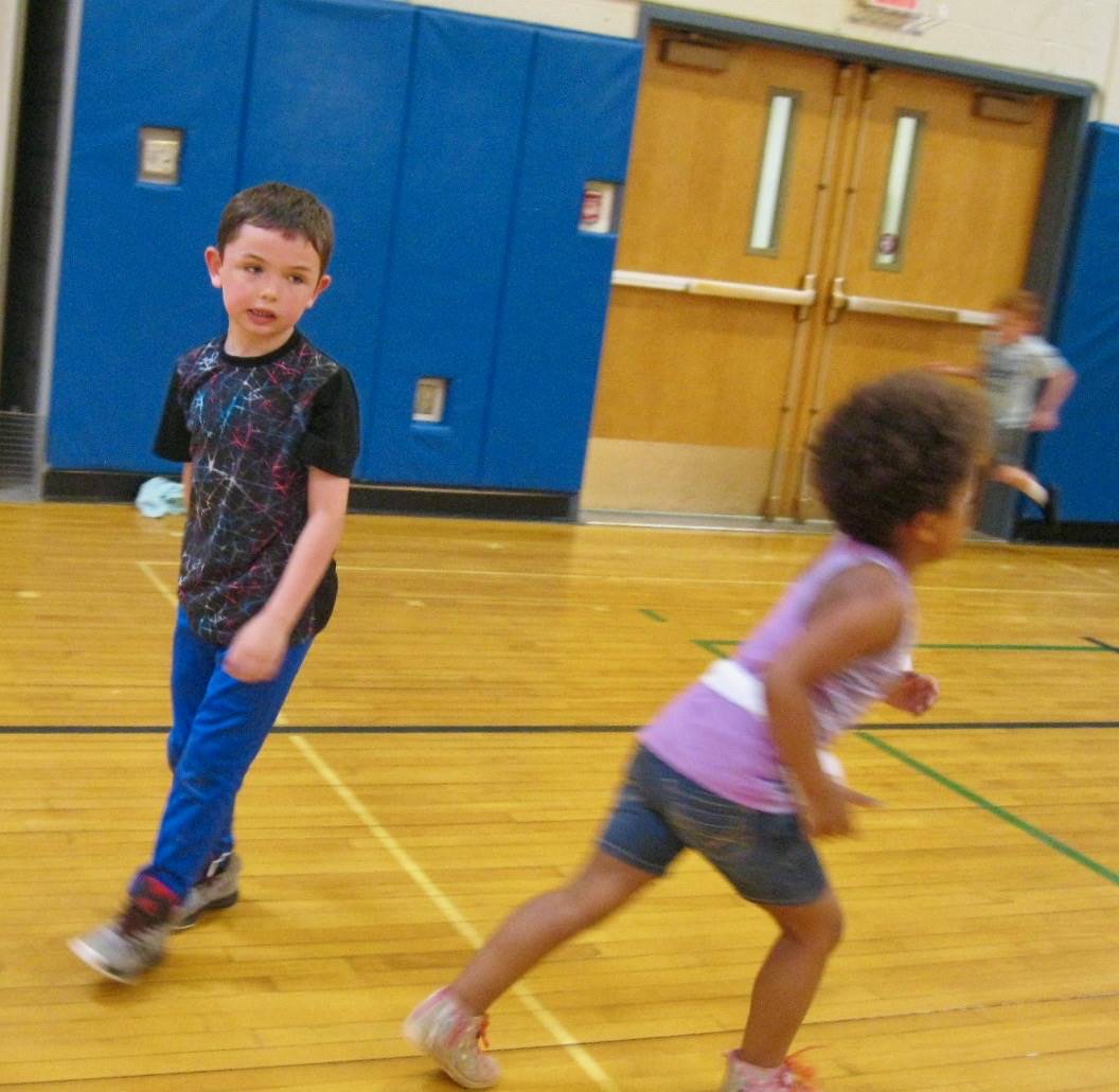 2 students playing mud tag.