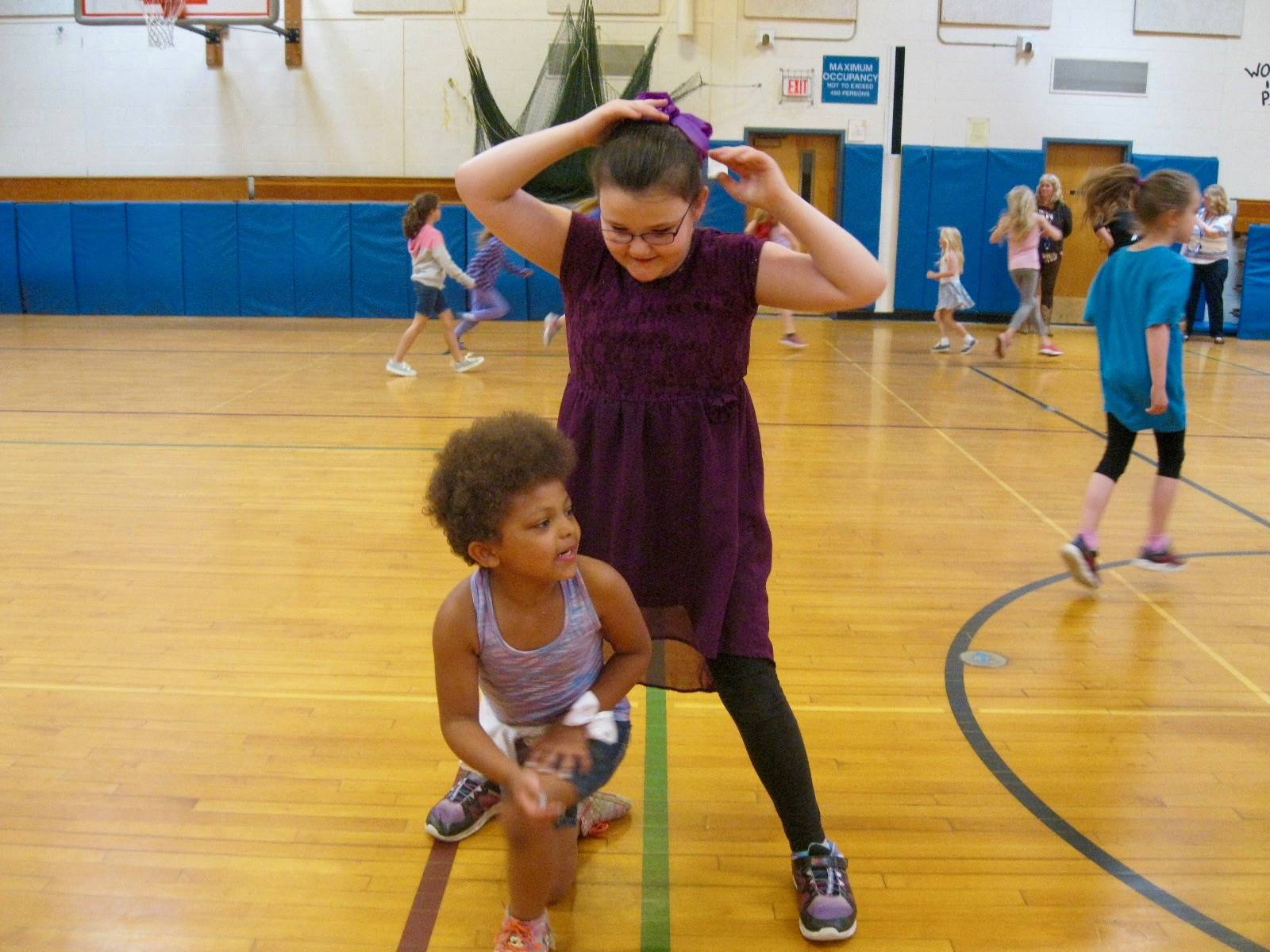 2 students playing mud tag.