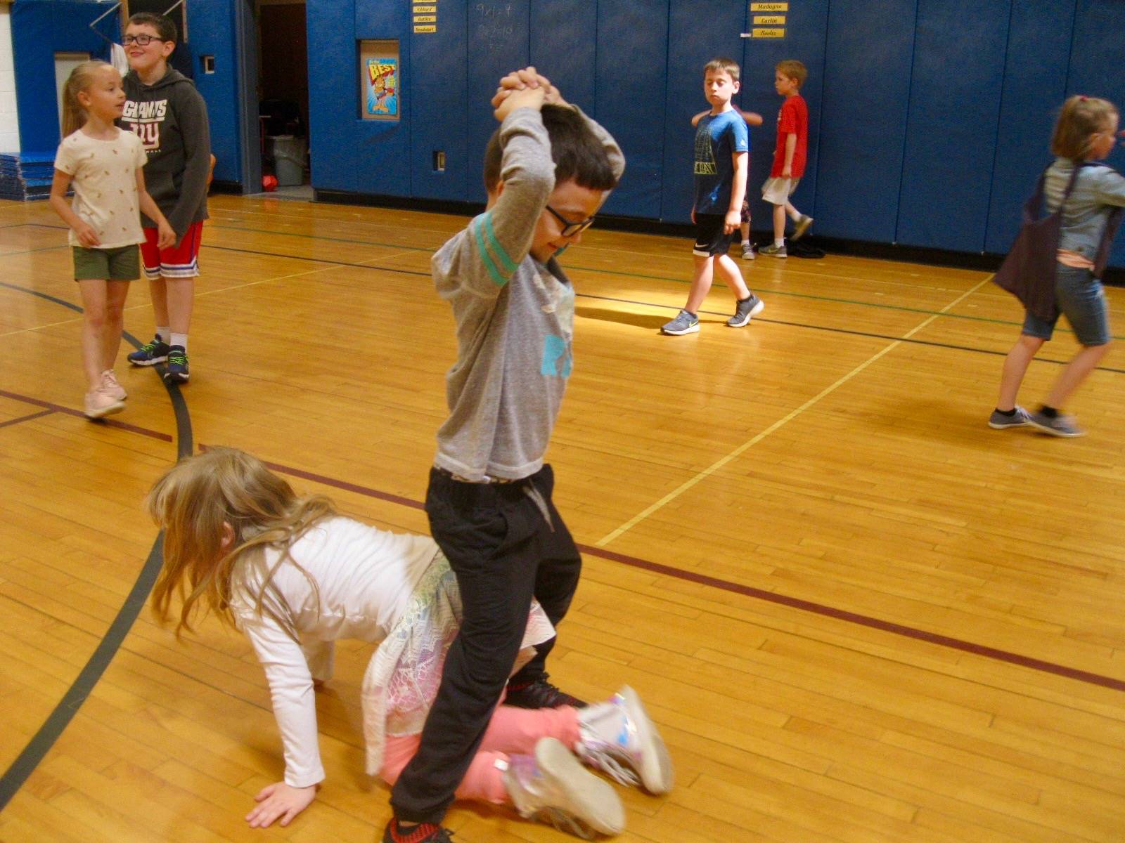 2 students playing mud tag.