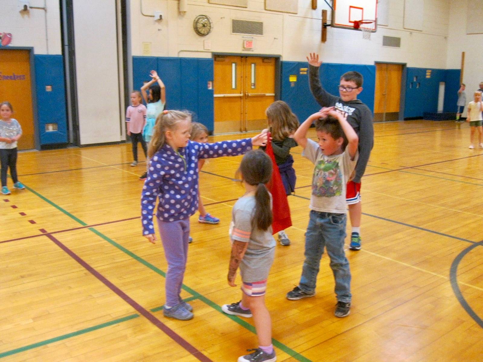 4 students playing mud tag!