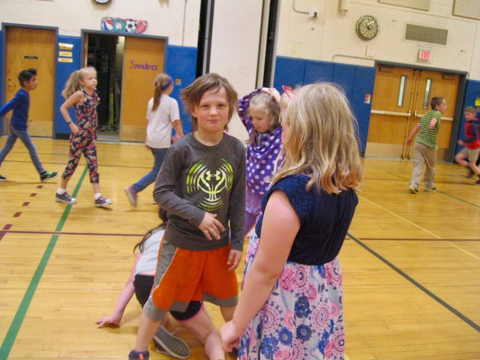 Students play mud tag.