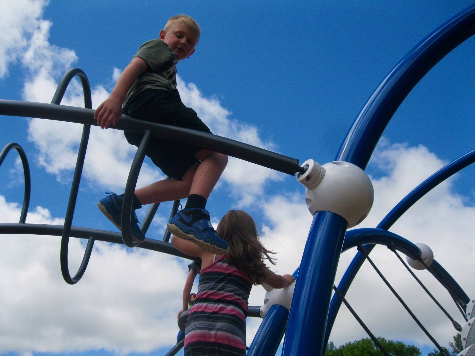 A student on top of the monkey bars!