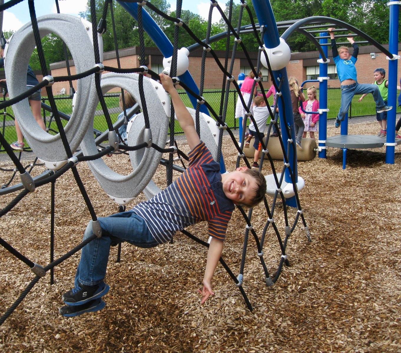 A student hanging out on the playground.