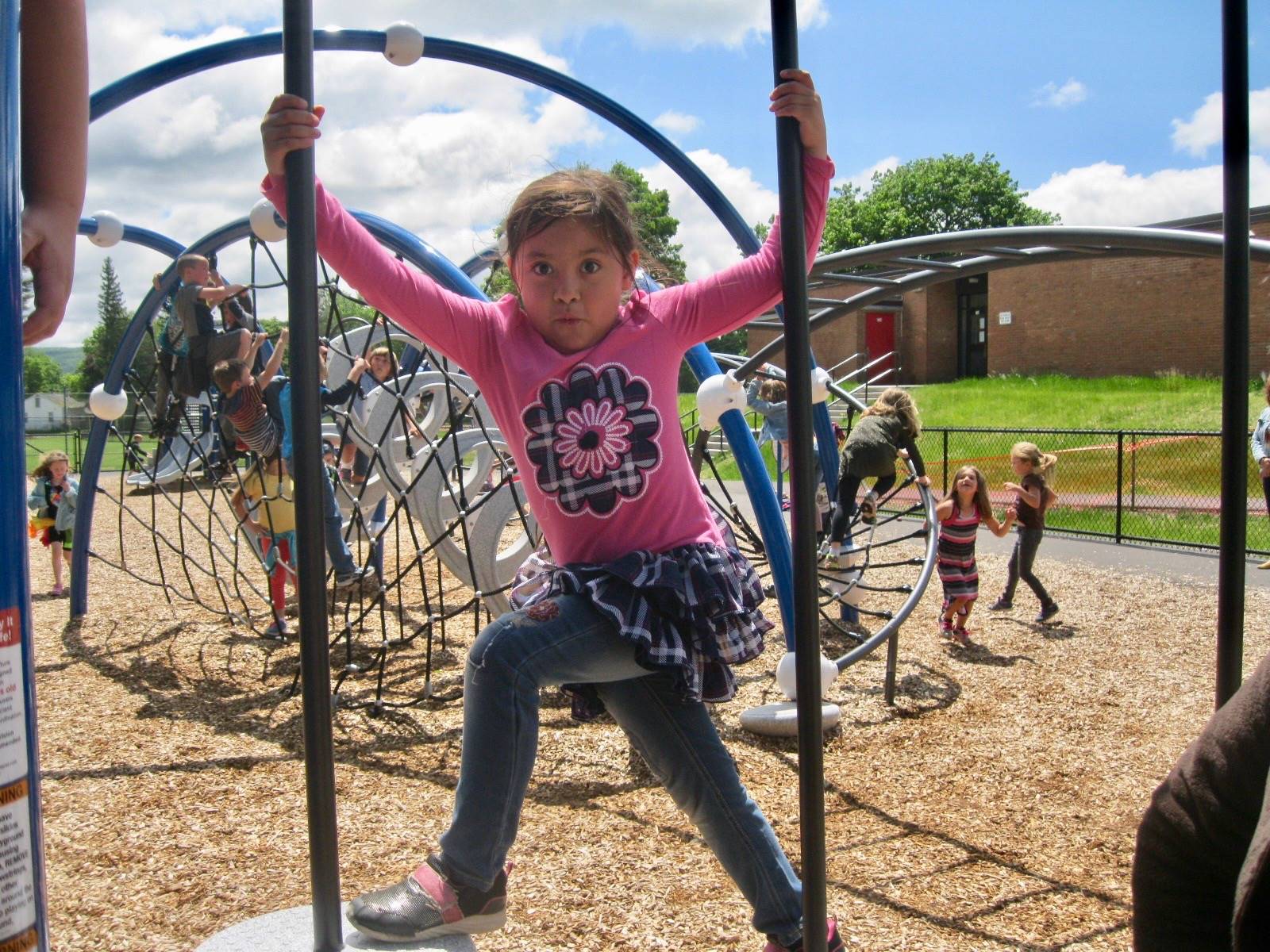 A student balancing on the playground.