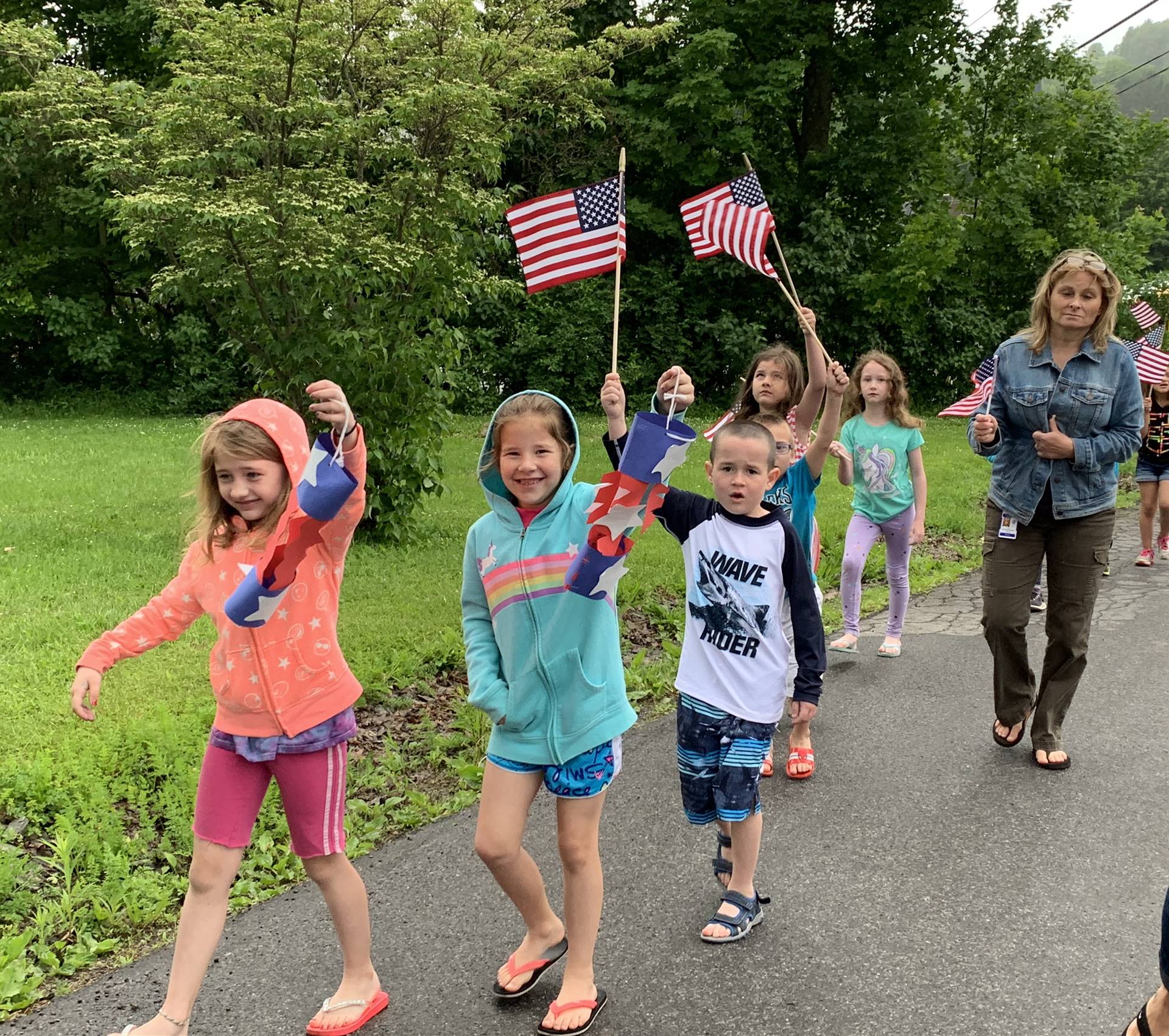 Students hold up flags and march.